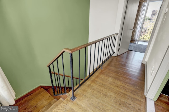 stairway with wood-type flooring