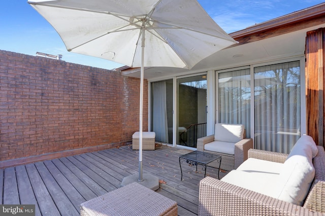 wooden deck featuring outdoor lounge area