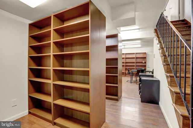 walk in closet featuring light hardwood / wood-style floors