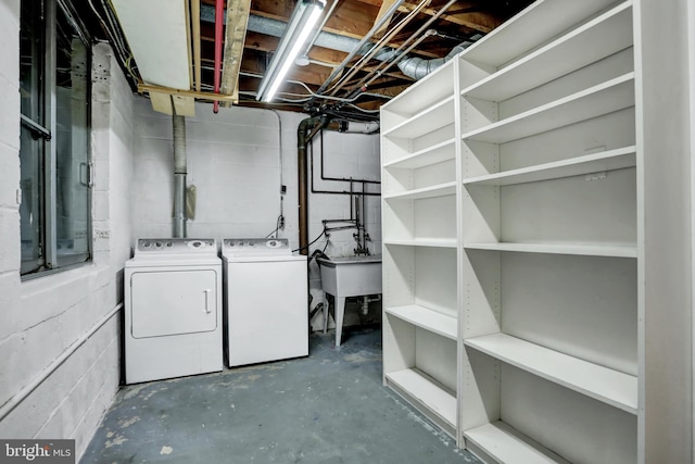 251 W Lafayette Ave, Baltimore, MD 21217 - unfinished basement featuring independent washer and dryer, concrete block wall, and a sink