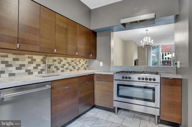 251 W Lafayette Ave, Baltimore, MD 21217 - kitchen featuring stainless steel appliances, backsplash, a chandelier, a sink, and brown cabinetry