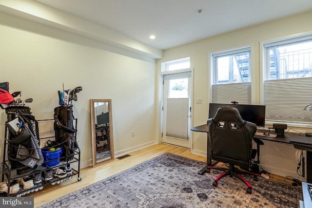 office space with light hardwood / wood-style flooring