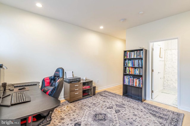 office area with light hardwood / wood-style flooring