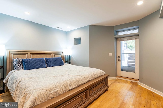 bedroom with light hardwood / wood-style floors