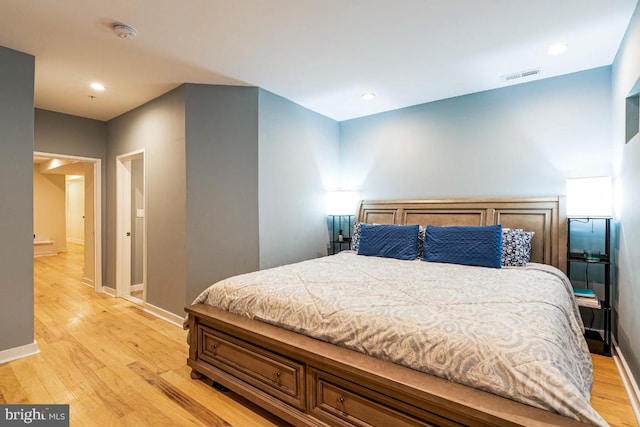 bedroom with light hardwood / wood-style floors