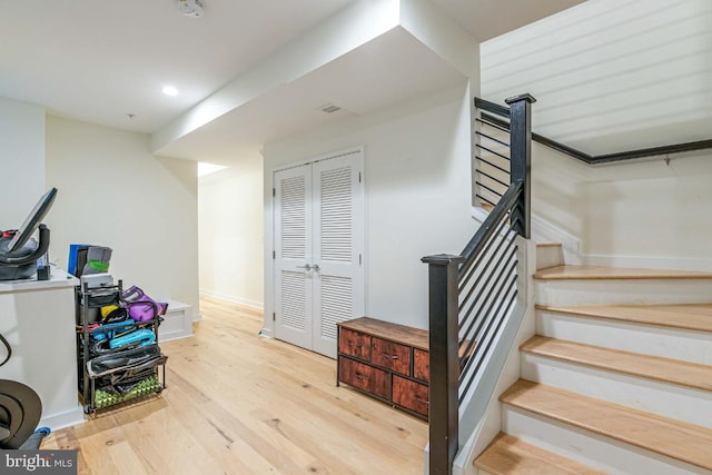 staircase featuring wood-type flooring