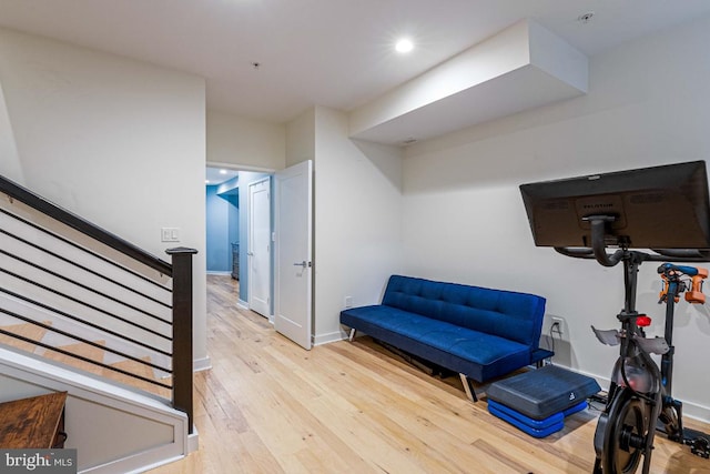 exercise area featuring light hardwood / wood-style floors