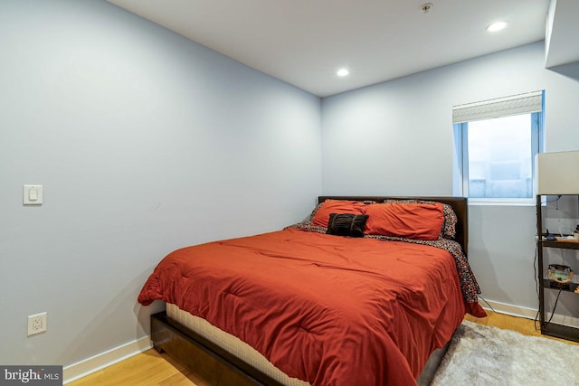 bedroom with light hardwood / wood-style floors