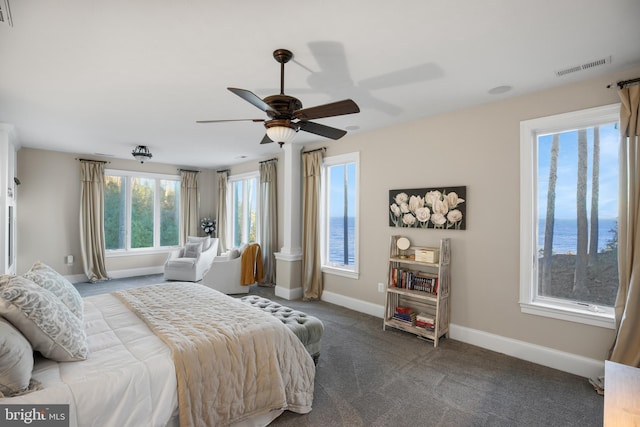 bedroom featuring carpet floors, baseboards, visible vents, and a ceiling fan