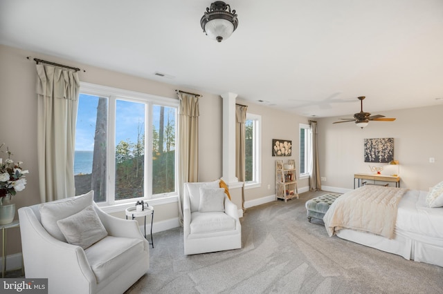 bedroom with a ceiling fan, carpet flooring, visible vents, and baseboards