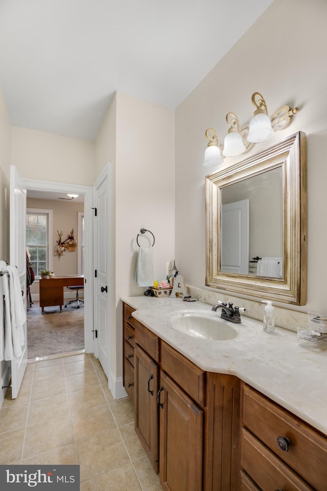 bathroom featuring tile patterned flooring and vanity