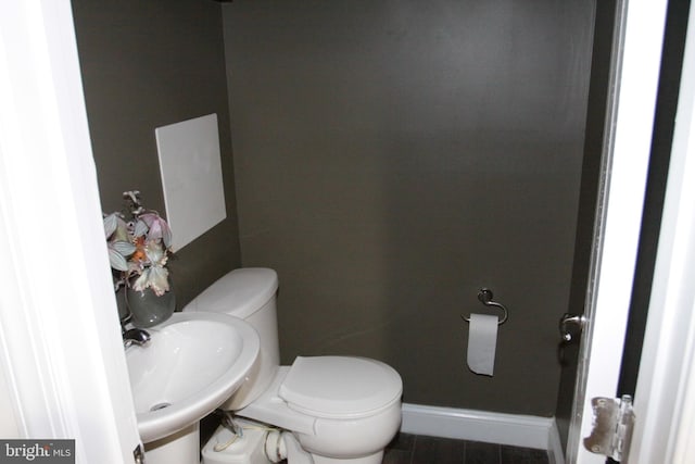 bathroom with tile patterned floors, sink, and toilet