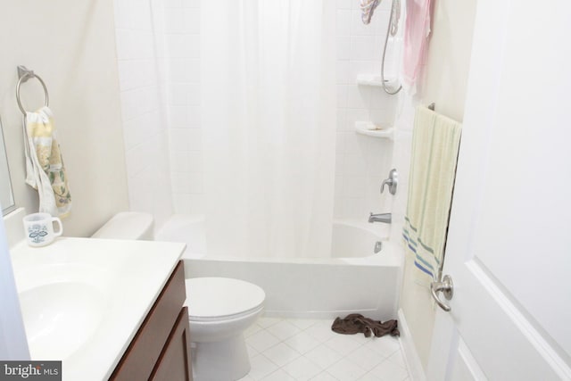 full bathroom with tile patterned floors, vanity, toilet, and shower / bath combo with shower curtain