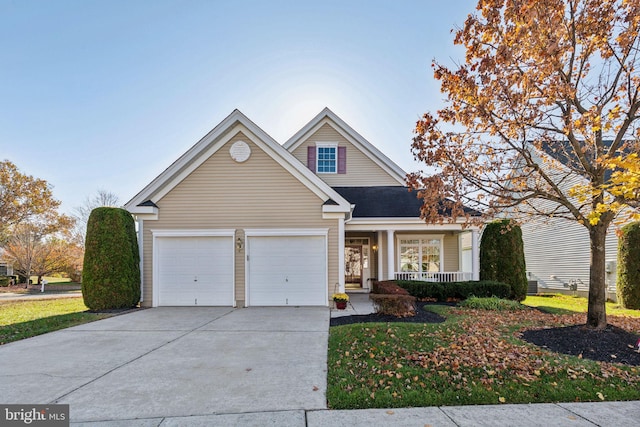 view of front property with covered porch and a garage