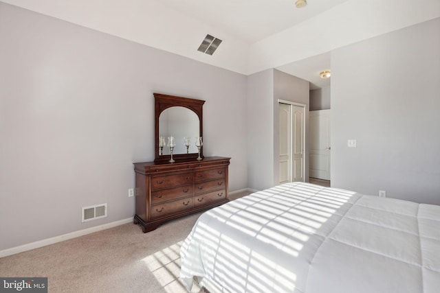 carpeted bedroom featuring a closet