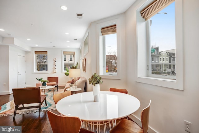 dining space featuring recessed lighting, dark wood-style flooring, visible vents, and baseboards