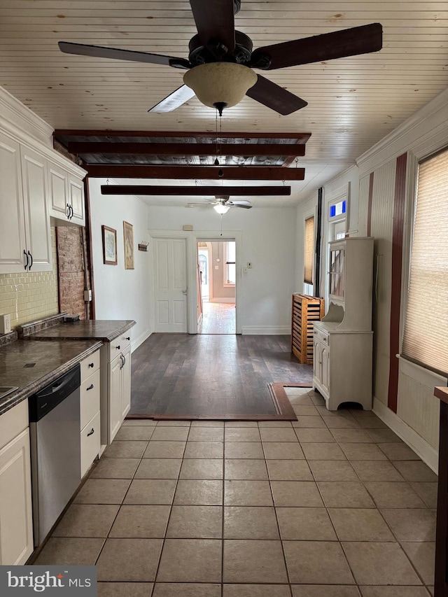 kitchen featuring dishwasher, ceiling fan, light tile patterned floors, tasteful backsplash, and white cabinetry