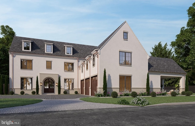 view of front of property with french doors and a garage