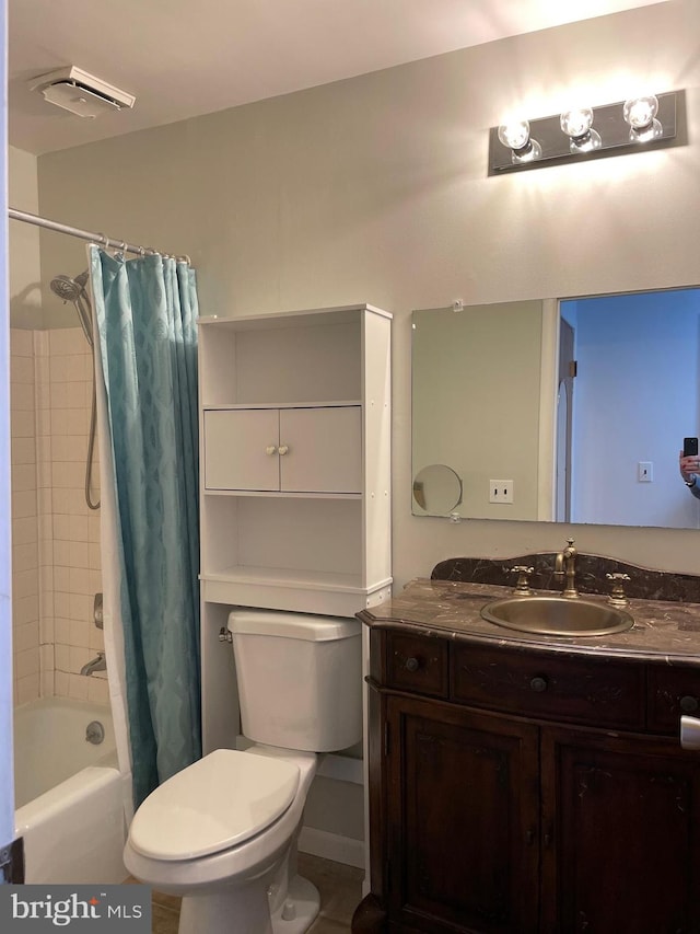 full bathroom featuring tile patterned flooring, vanity, toilet, and shower / bathtub combination with curtain