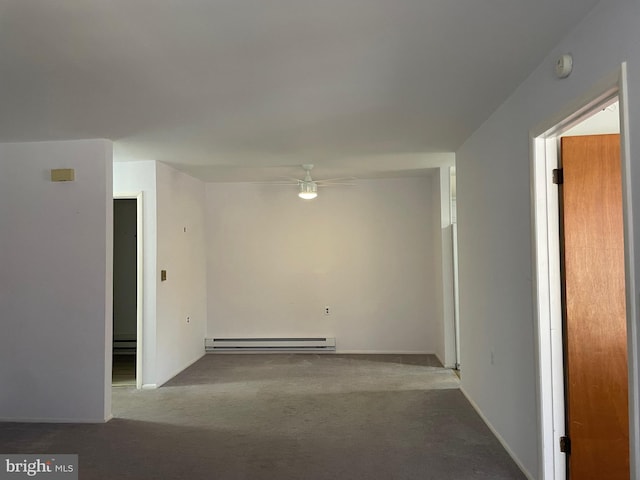 carpeted empty room featuring ceiling fan and a baseboard radiator