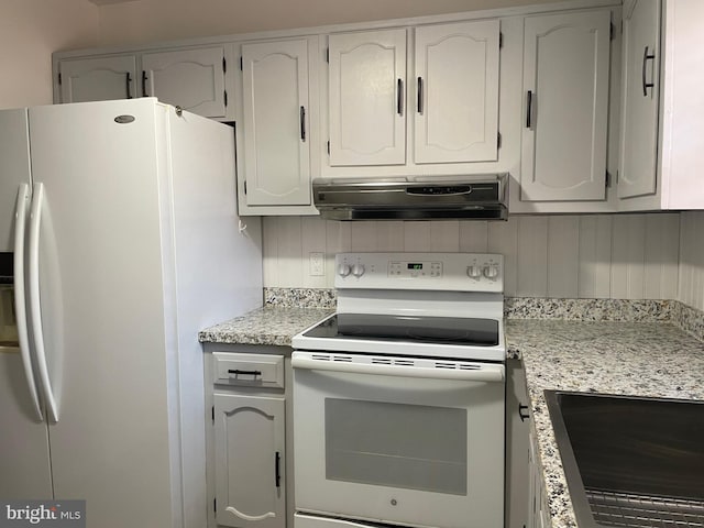 kitchen featuring white cabinets, white appliances, light stone countertops, and range hood