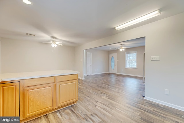 interior space with light hardwood / wood-style flooring and ceiling fan