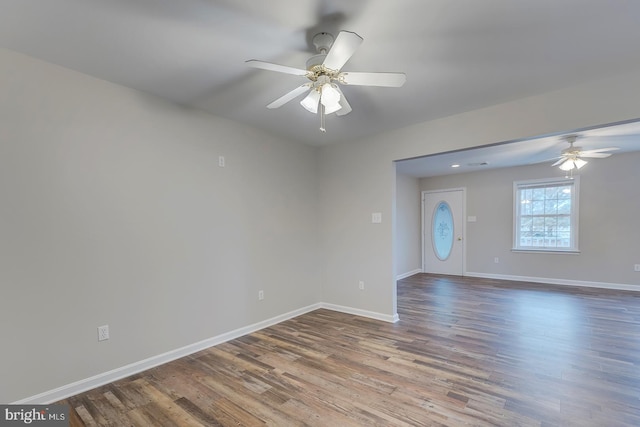 spare room featuring hardwood / wood-style flooring and ceiling fan