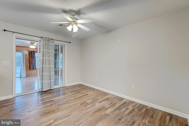 unfurnished room featuring ceiling fan and light wood-type flooring