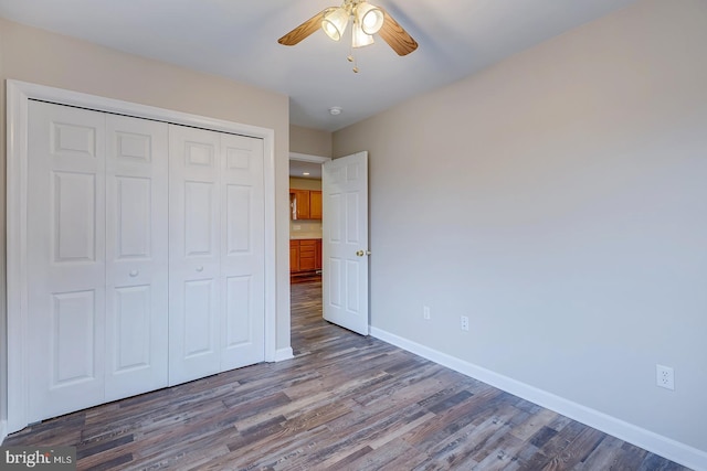 unfurnished bedroom with a closet, ceiling fan, and hardwood / wood-style floors