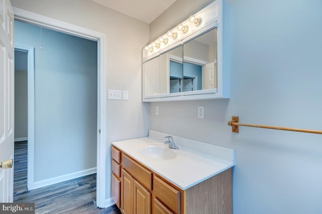 bathroom featuring vanity and hardwood / wood-style flooring