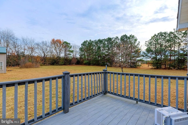 wooden deck featuring a yard