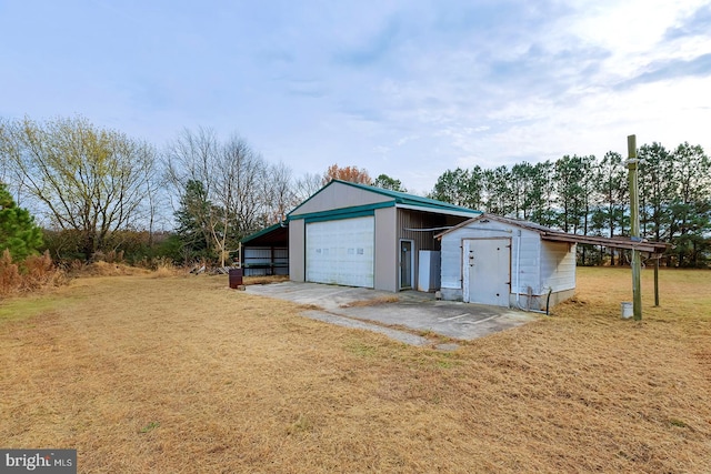 garage with a yard and a carport