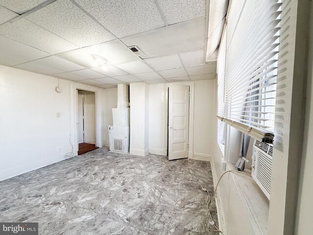 unfurnished bedroom featuring a paneled ceiling