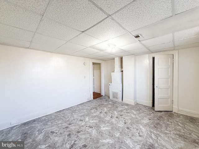 basement featuring a drop ceiling