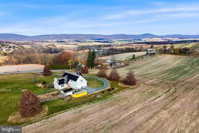 drone / aerial view featuring a mountain view and a rural view