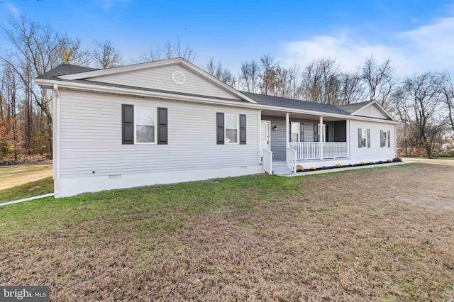 ranch-style home with a porch and a front lawn