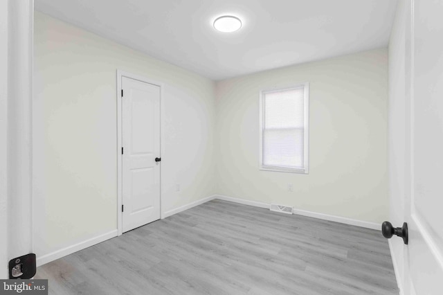 unfurnished room featuring light hardwood / wood-style floors