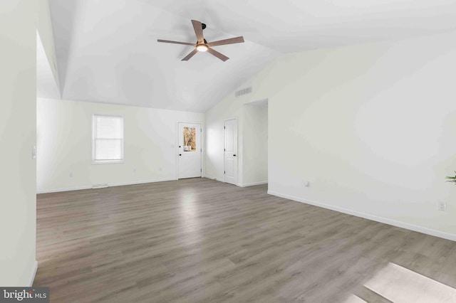 interior space with hardwood / wood-style flooring, ceiling fan, and lofted ceiling