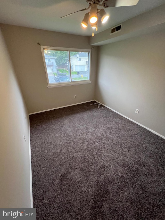 unfurnished room with carpet and ceiling fan