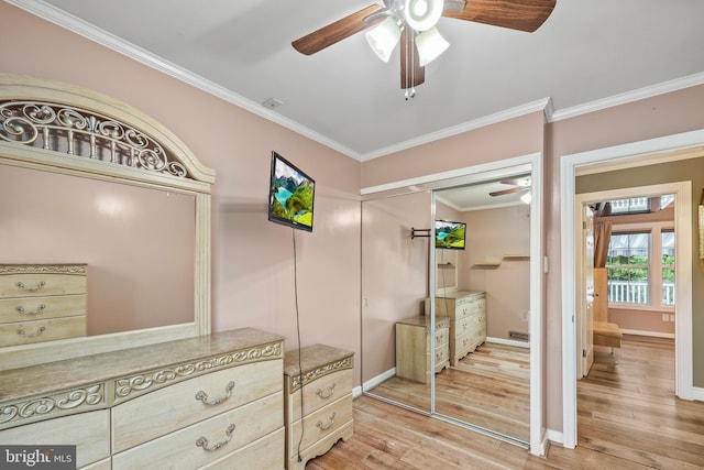 interior space featuring crown molding, hardwood / wood-style floors, and ceiling fan