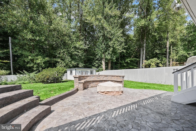 view of patio / terrace featuring an outdoor structure