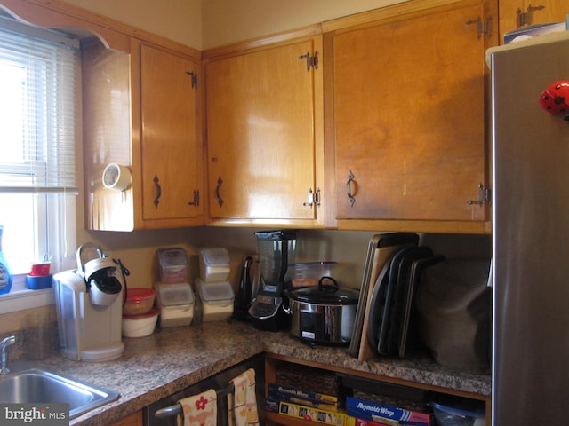 kitchen with stainless steel refrigerator and sink