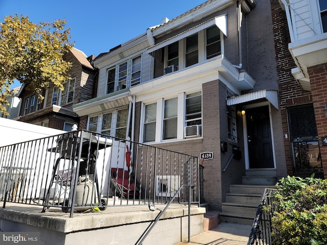 view of front of house featuring cooling unit