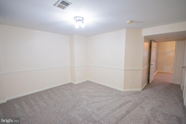 spare room featuring carpet flooring