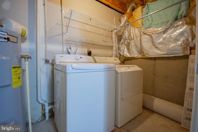 washroom featuring separate washer and dryer and electric water heater