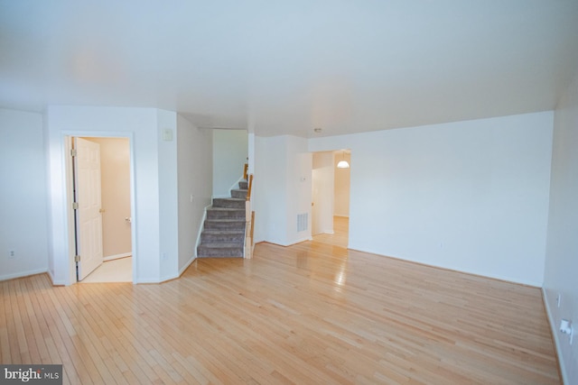 unfurnished living room with light hardwood / wood-style flooring