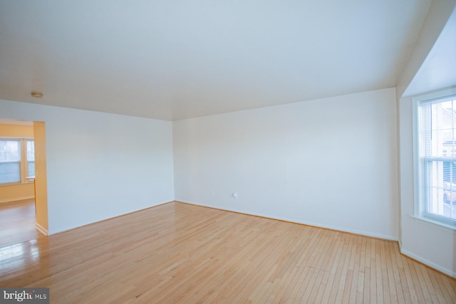 unfurnished room with light wood-type flooring