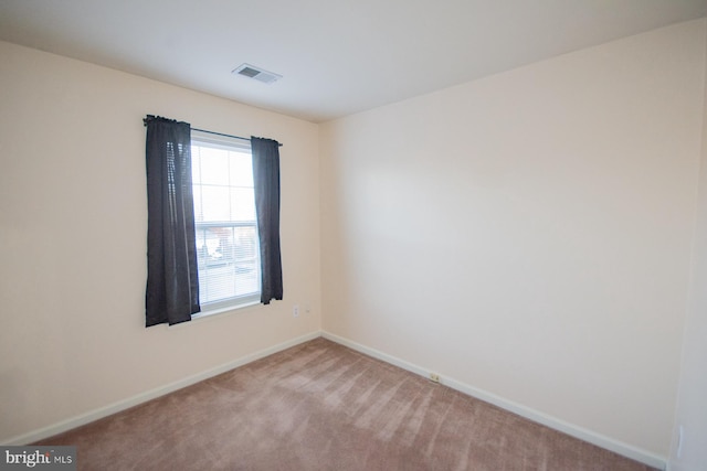 view of carpeted spare room