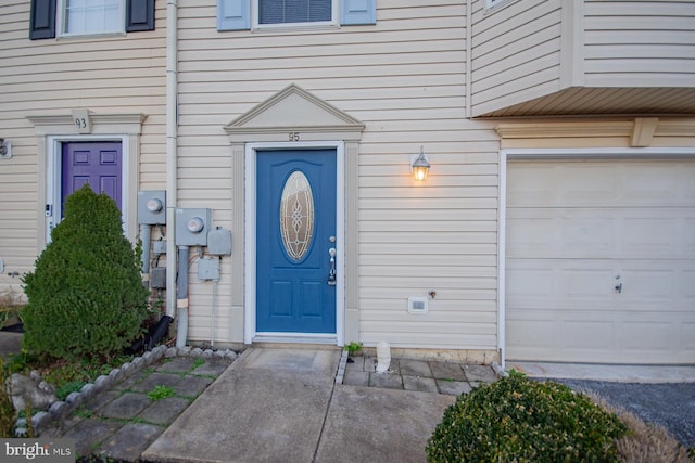 entrance to property featuring a garage