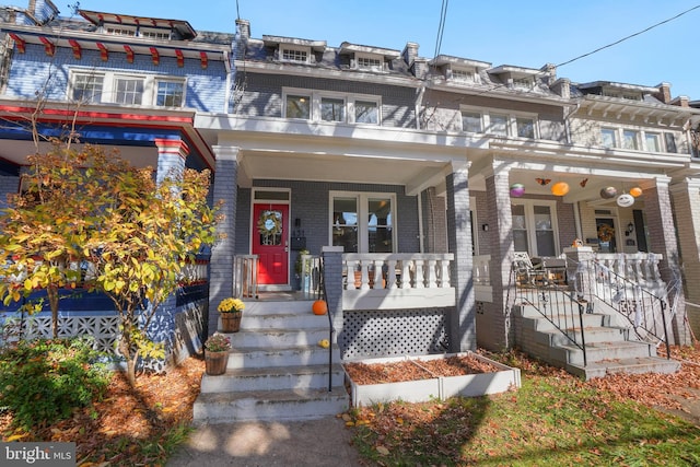 multi unit property featuring a porch